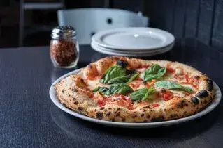 Stone and Char Pizzeria — custom pizza restaurant website with online ordering, pizza builder, and delivery tracking, built with PHP MySQL Stripe
